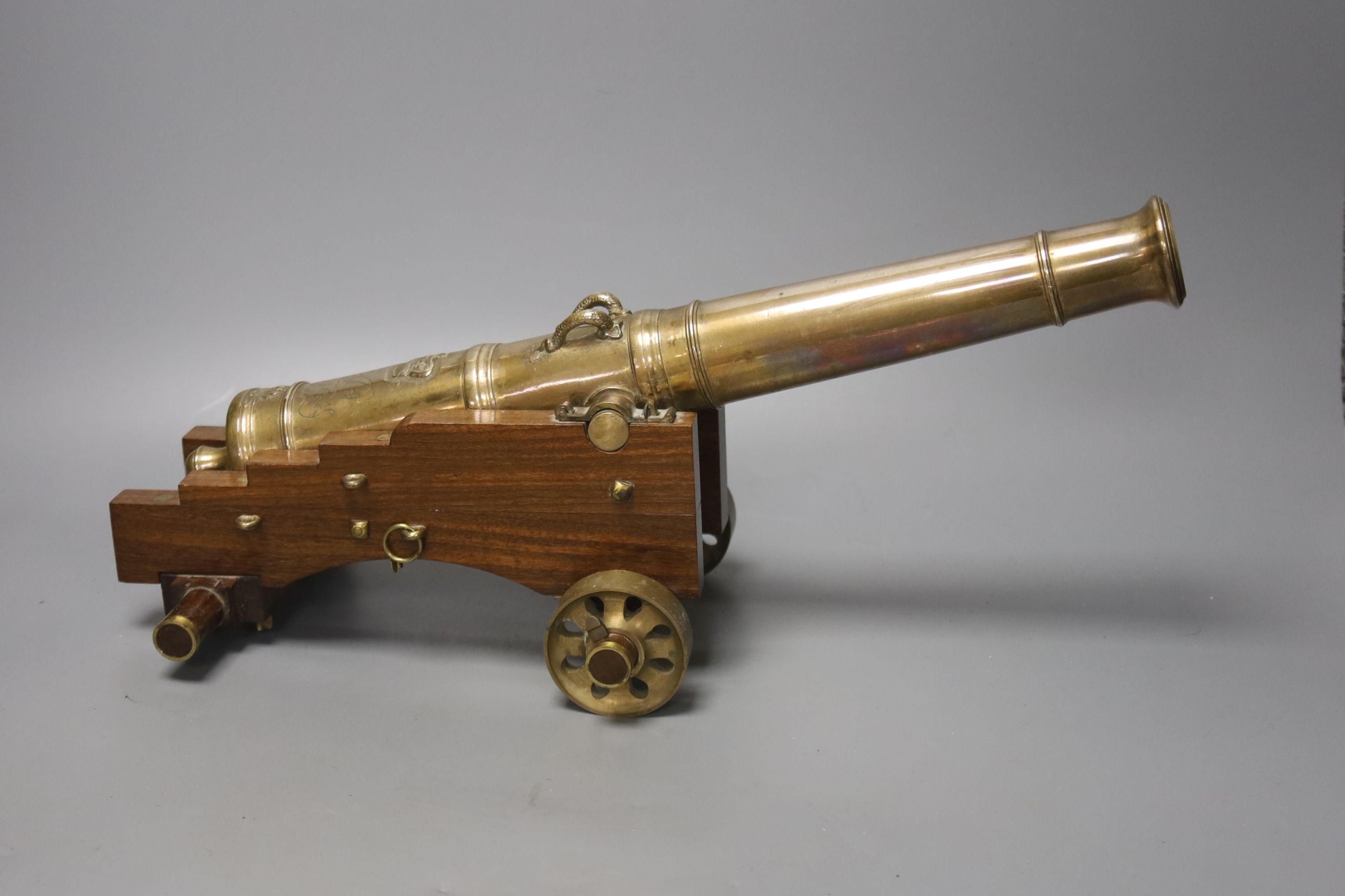 A 20th century bronze model cannon on wooden base, overall length 38cm